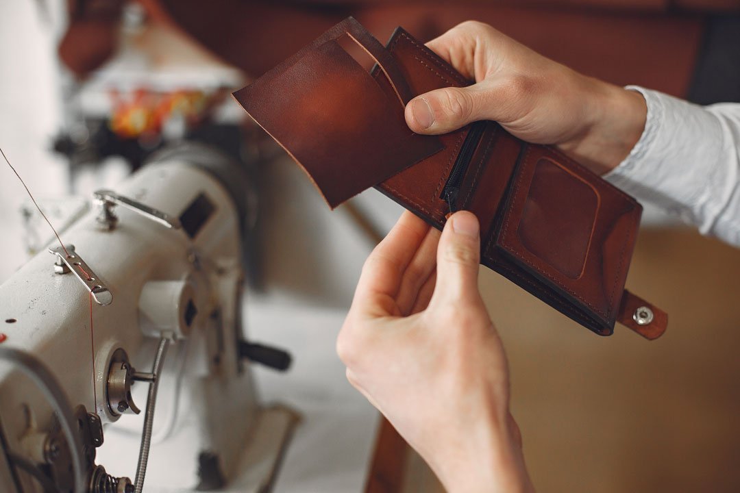 Artisan crafting leather goods